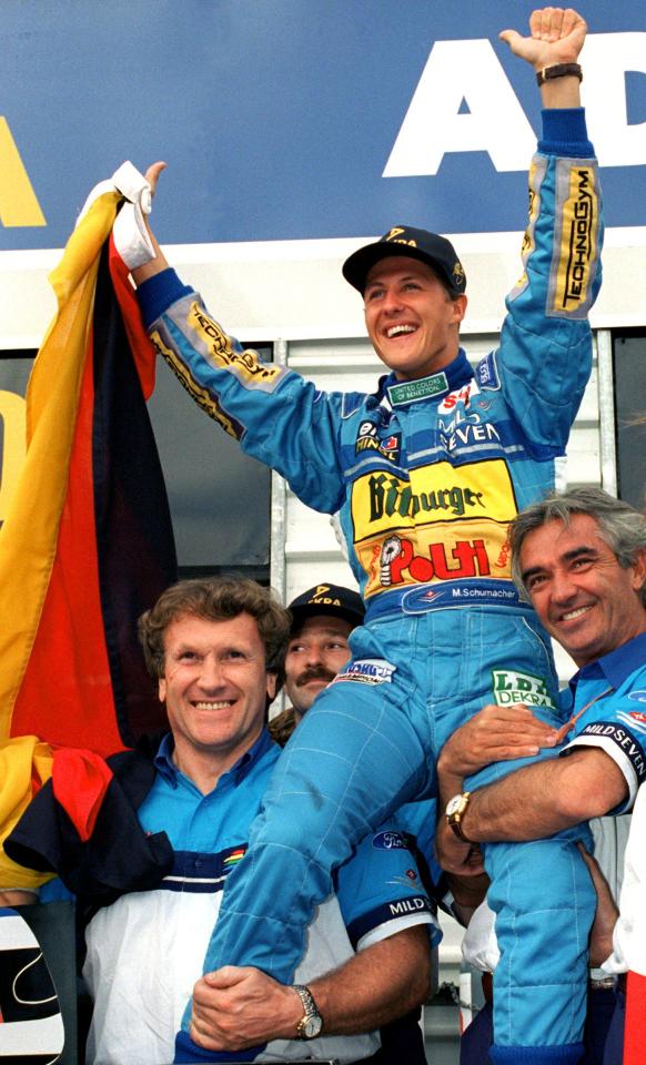 Michael Schumacher, the first German Formula 1 world champion, being celebrated by his team.