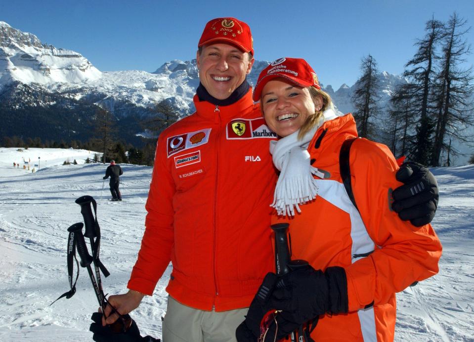 Michael Schumacher and his wife Corinna skiing in the mountains.