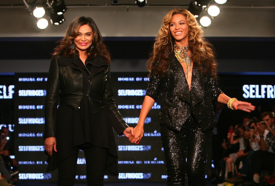 Beyoncé and Tina Knowles holding hands after a House of Dereon fashion show.