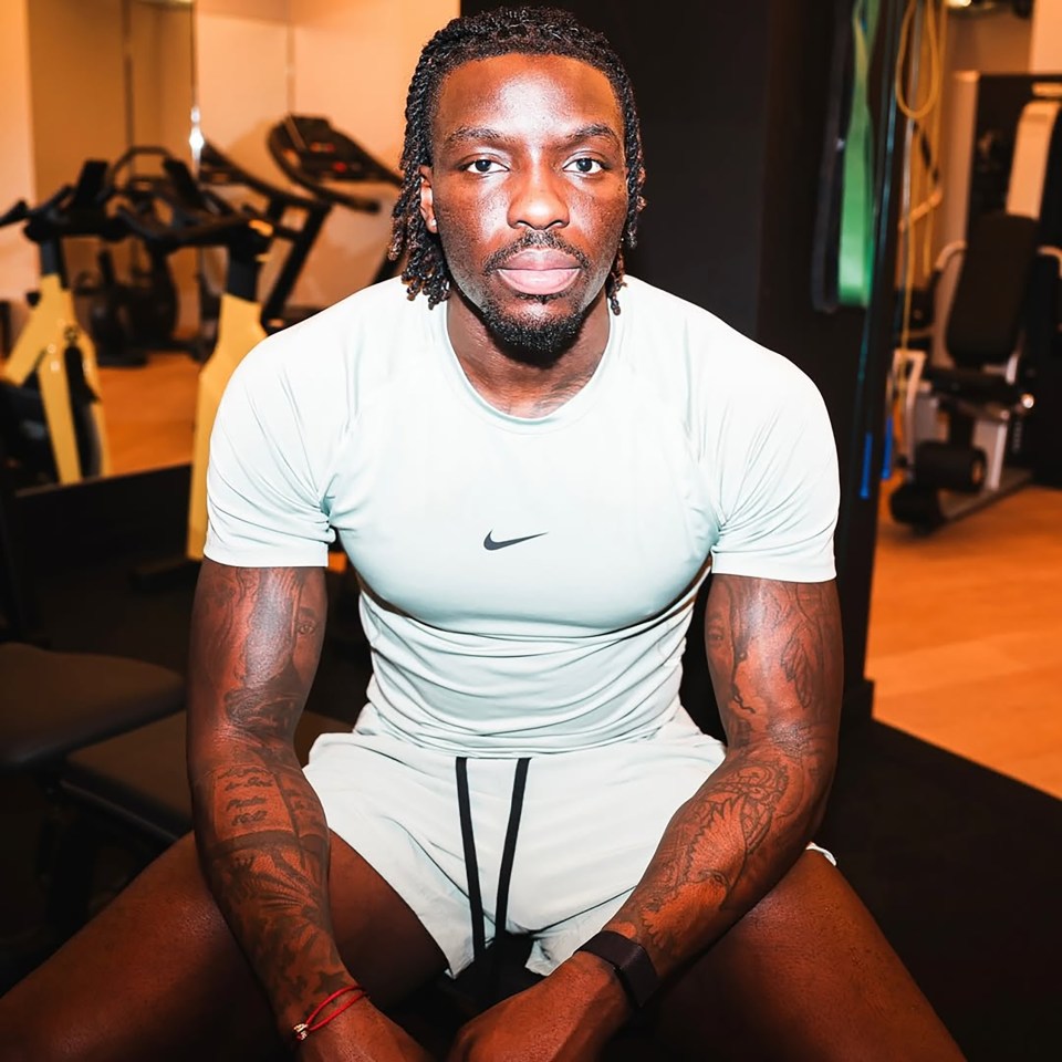 Portrait of Dejon Noel Williams in a gym.