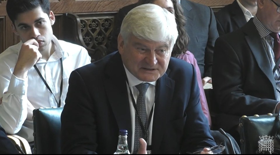 Sir Adrian Montague answering questions at the House of Commons.