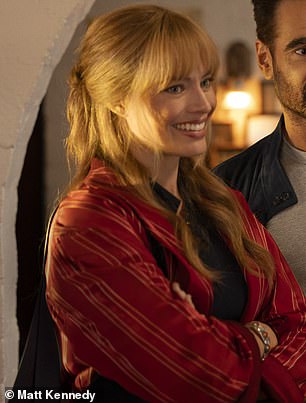 In the trailer, the Queensland-born star, 34, rocks strawberry blonde locks and a thick fringe, a swift departure from her Barbie roots.