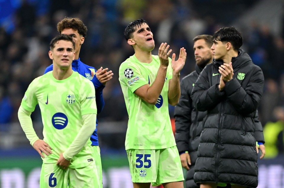 FC Barcelona players looking dejected after a game.