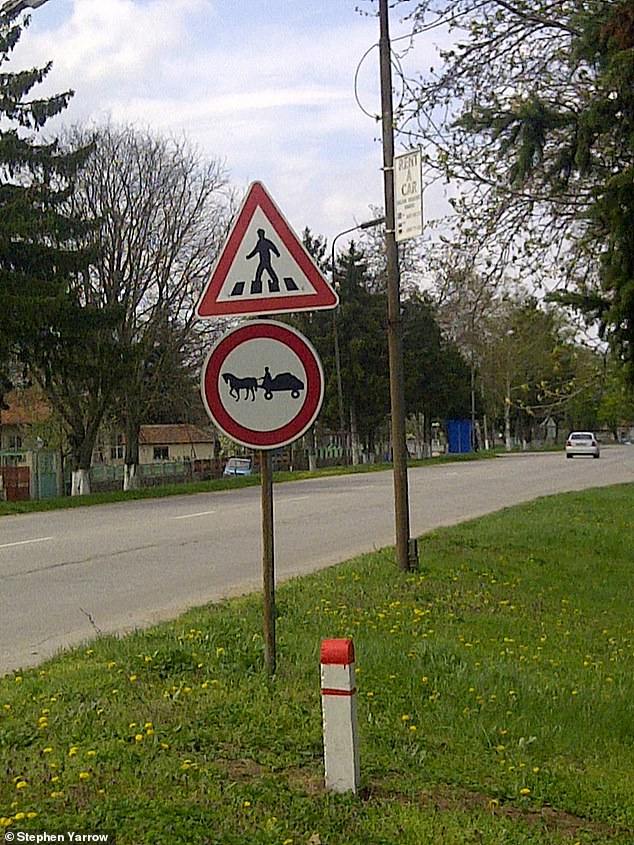 Road signs warning of animal-drawn carriages are common close to where he lives
