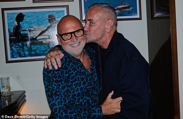 DJ Fat Tony planted a kiss on Sam's cheek as he celebrated the big 70