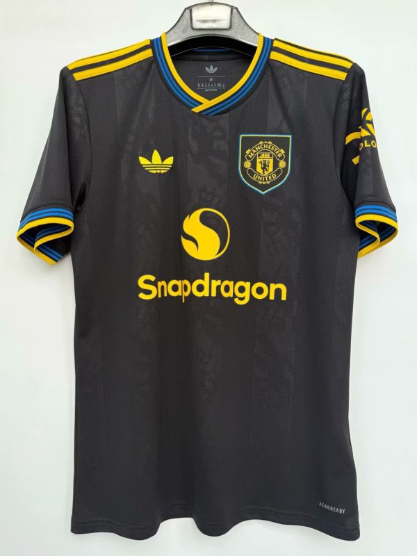 Manchester United's black third kit with Snapdragon sponsor.