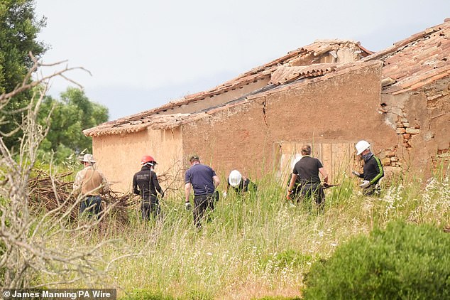 Search teams clear branches at a derelict and abandoned property to the west of Praia De Luz