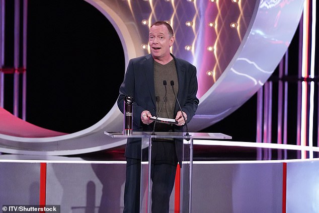 Steve McFadden, who plays fan favourite Phil Mitchell, won the Best Dramatic Performance award, which was accepted by castmate Adam Woodyatt on his behalf (seen)