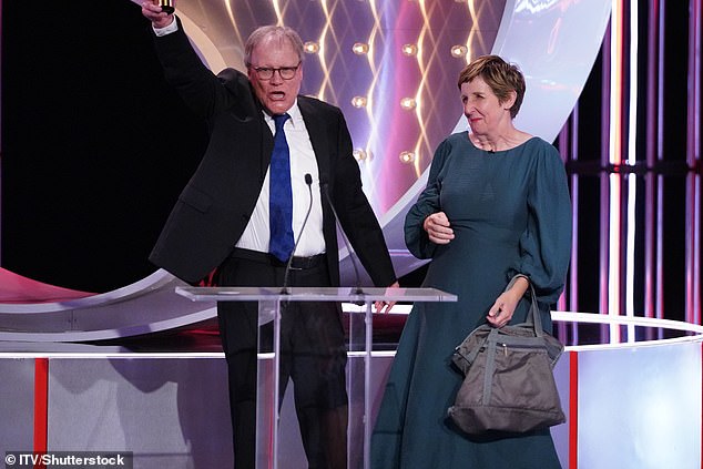 The star has played Roy Cropper for 30 years and was presented the gong by Julie Hesmondhalgh (seen)