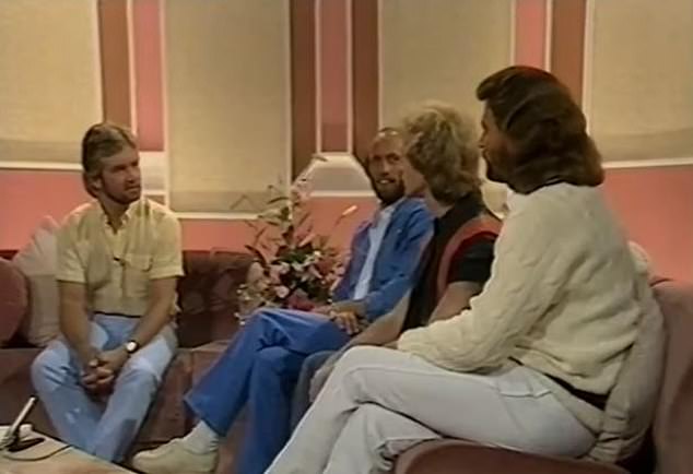 Noel (far left) pictured interviewing (L-R) Maurice, Robin and Barry Gibb in 1983