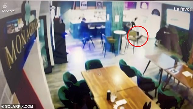 Video broadcast on Spanish TV shows the gunman(centre) storm through the bar and take aim at Monaghan