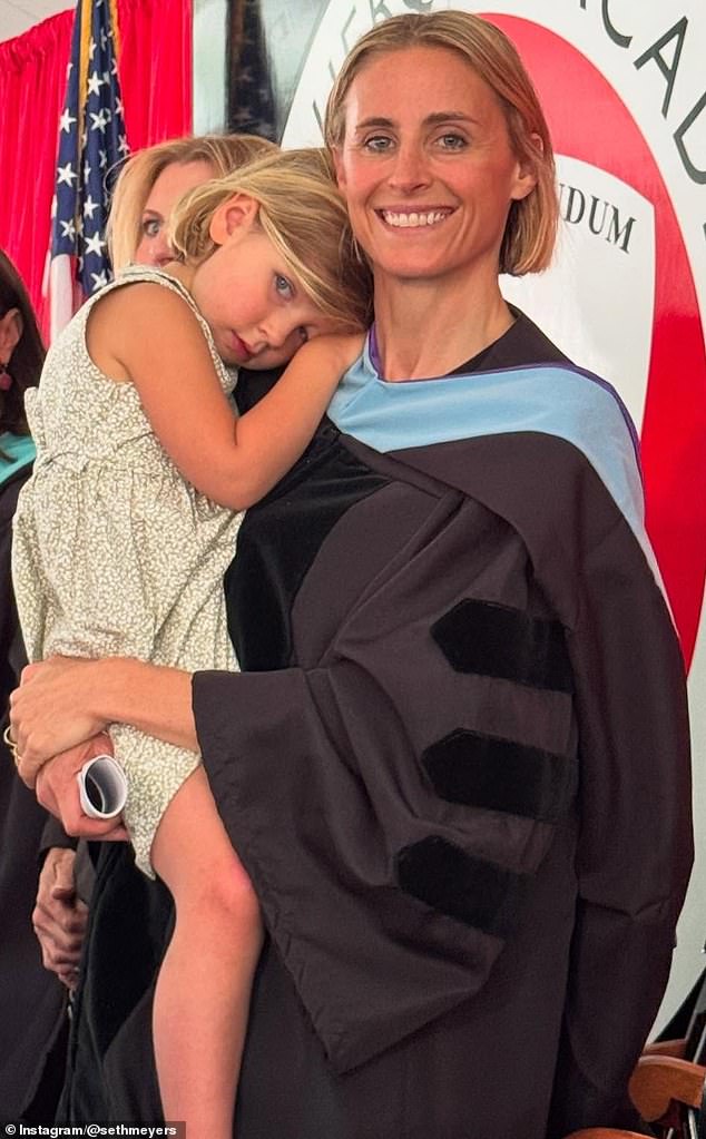 Ashe was seen cradling their three-year-old daughter Adelaide during her commencement address earlier this week