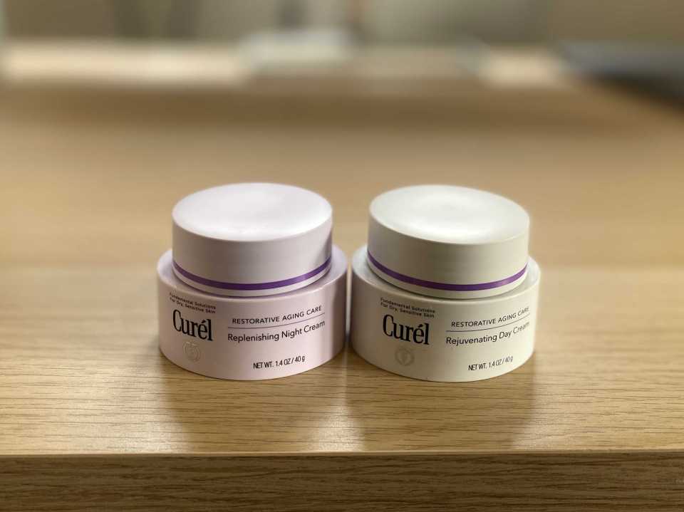 Curel Rejuvenating Day Cream and Replenishing Night Cream jars.