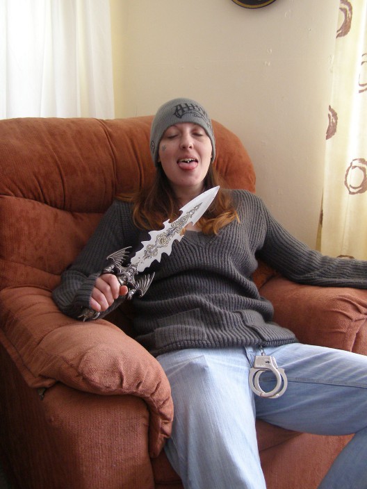 Handout photo of Joanna Dennehy's accomplice holding a knife and handcuffs.