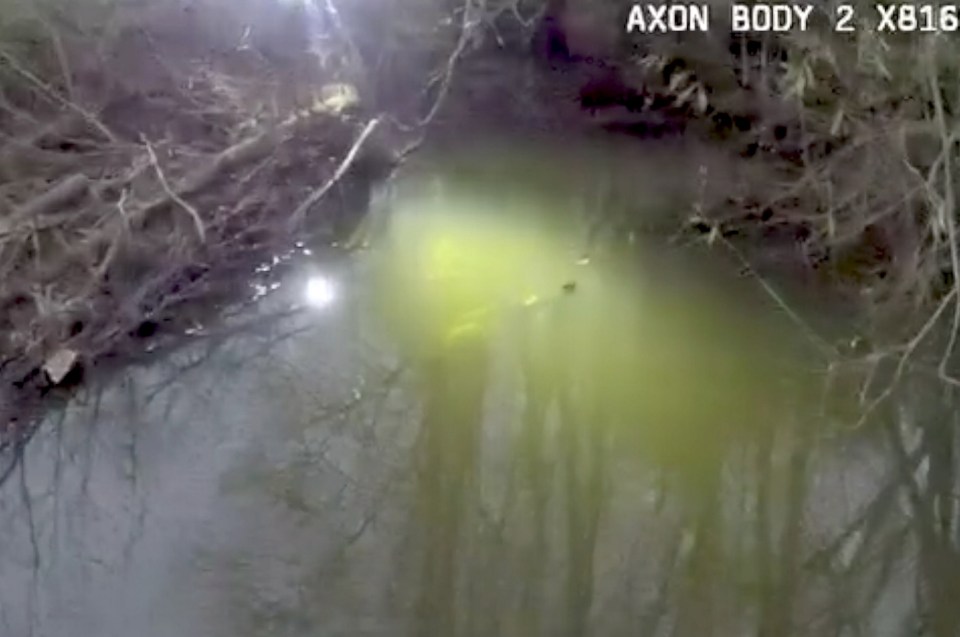 Motorcycle submerged in a river.