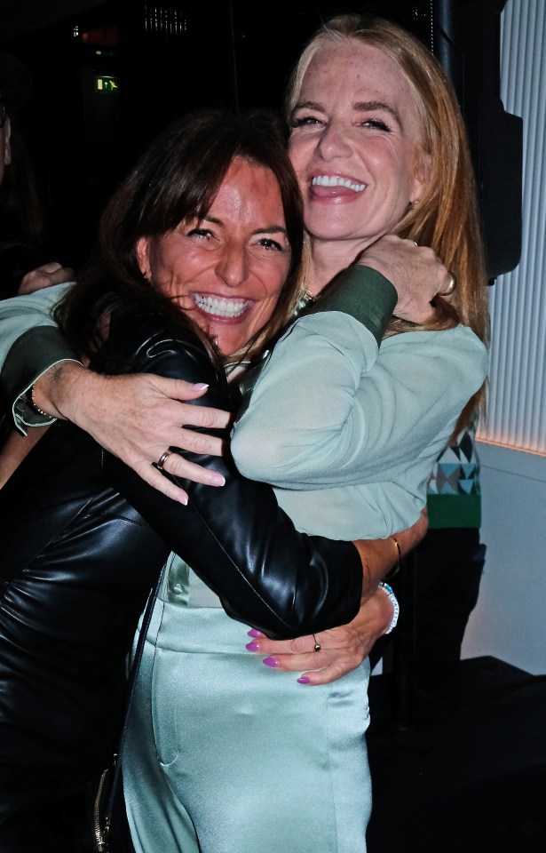 Davina McCall and Patsy Palmer hugging at a party.