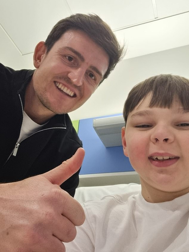 Manchester United centre-back Harry Maguire is pictured meeting with Tony in hospital