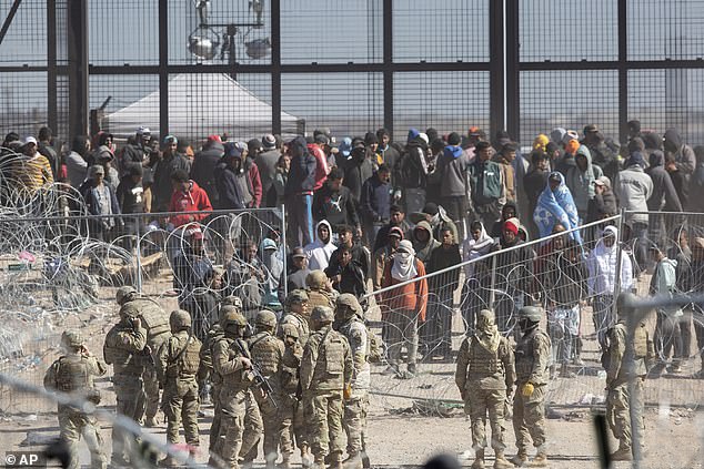 Terrorists intent on striking the US homeland may have already infiltrated America, hidden among more than 10 million illegal immigrants who entered the country on Biden's watch, says Swecker. (Above) Migrants breach barriers set up on the Rio Grande in El Paso, Texas on March 21, 2024