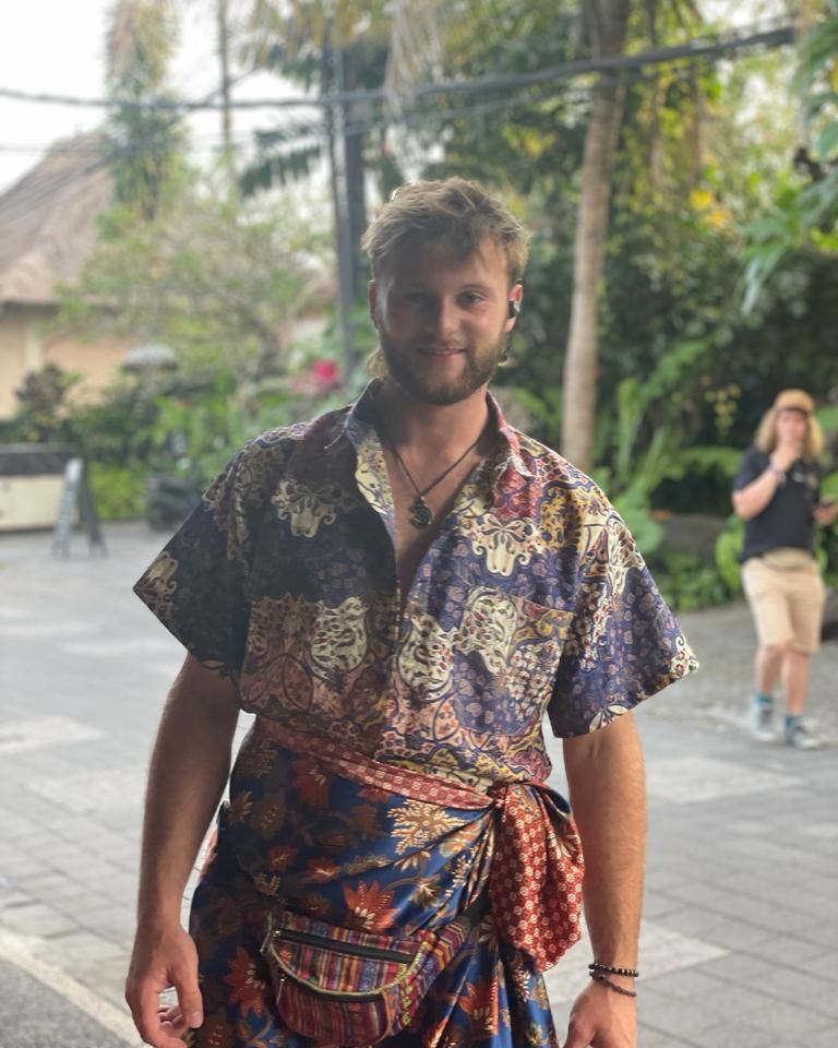 Sam Gardiner, Race Across the World contestant, wearing a patterned shirt and sarong.