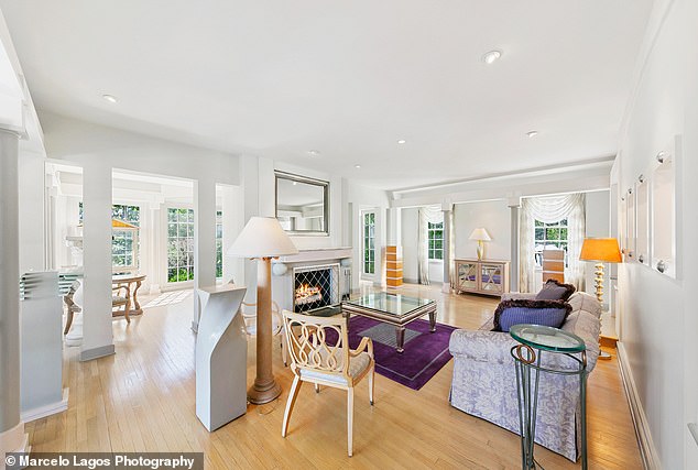 The gated home boasts a colonial style