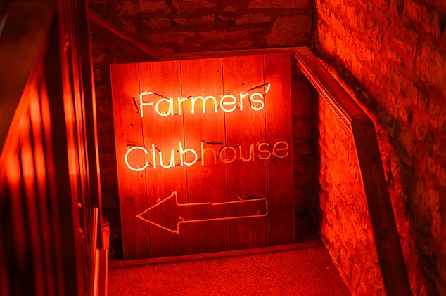 The Farmer's Dog stunning interior is also shown, including a funky red light up sign that says Farmers' Clubhouse