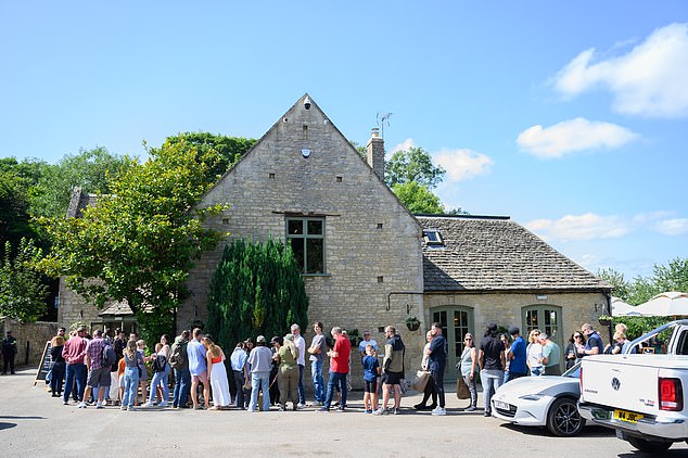 Other pictures show guests waiting outside to have a look inside the lavish eatery