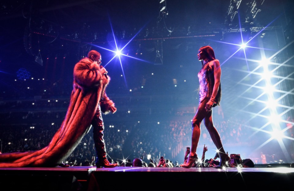 Usher and Naomi Campbell on stage.