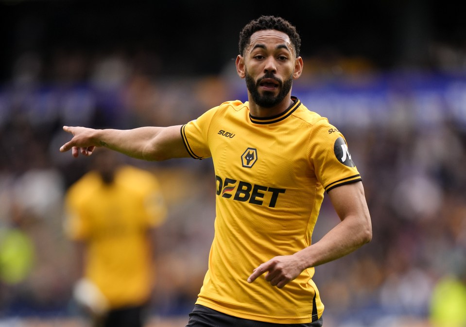 Matheus Cunha of Wolverhampton Wanderers in a yellow jersey.