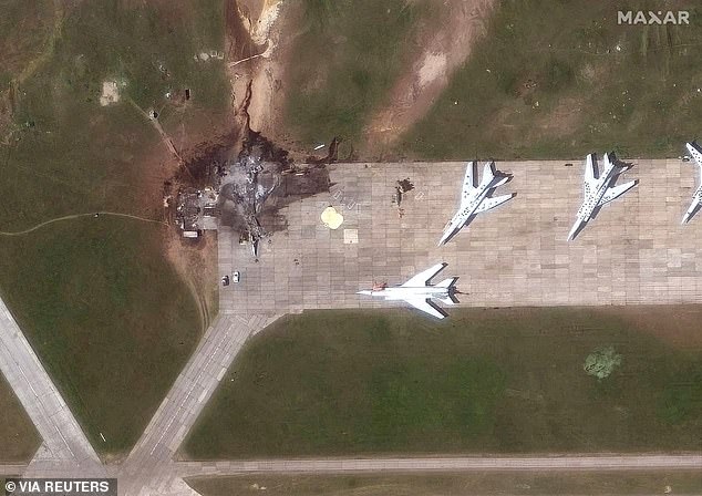 A satellite image shows a destroyed TU 22 aircraft in the aftermath of a drone strike at the Belaya air base, Irkutsk region, Russia