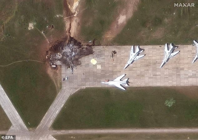 The strikes took place on Sunday, with footage released today showing flames engulfing aircraft at four military airfields (pictured Belaya Airbase)
