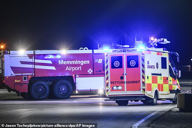 Pictures show the passenger jet on the tarmac in Memmingen alongside emergency vehicles