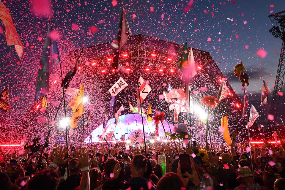 Crowd at Glastonbury Festival watching Coldplay perform.