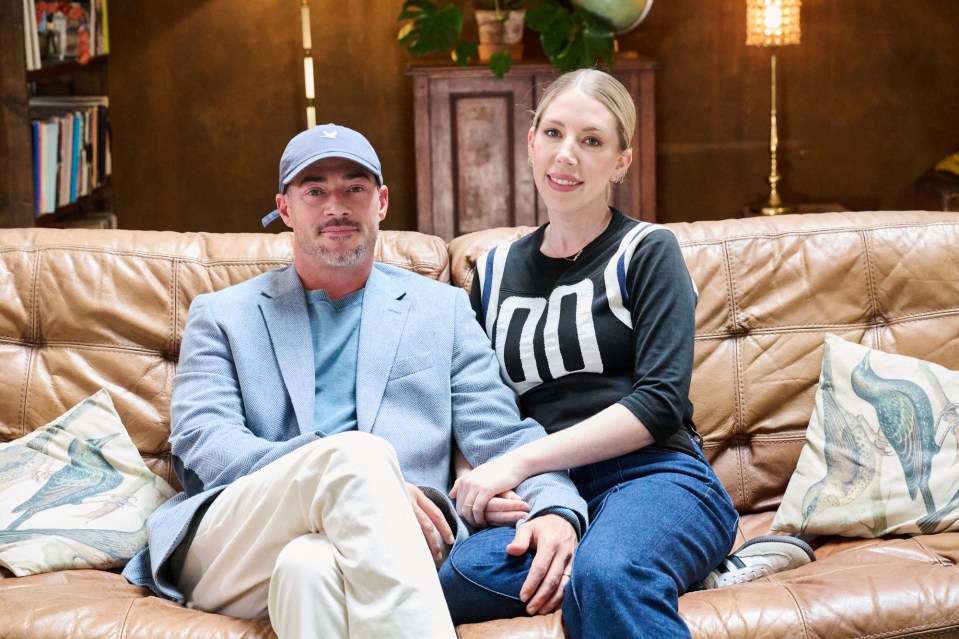 Bobby Kootstra and Katherine Ryan sitting on a couch.