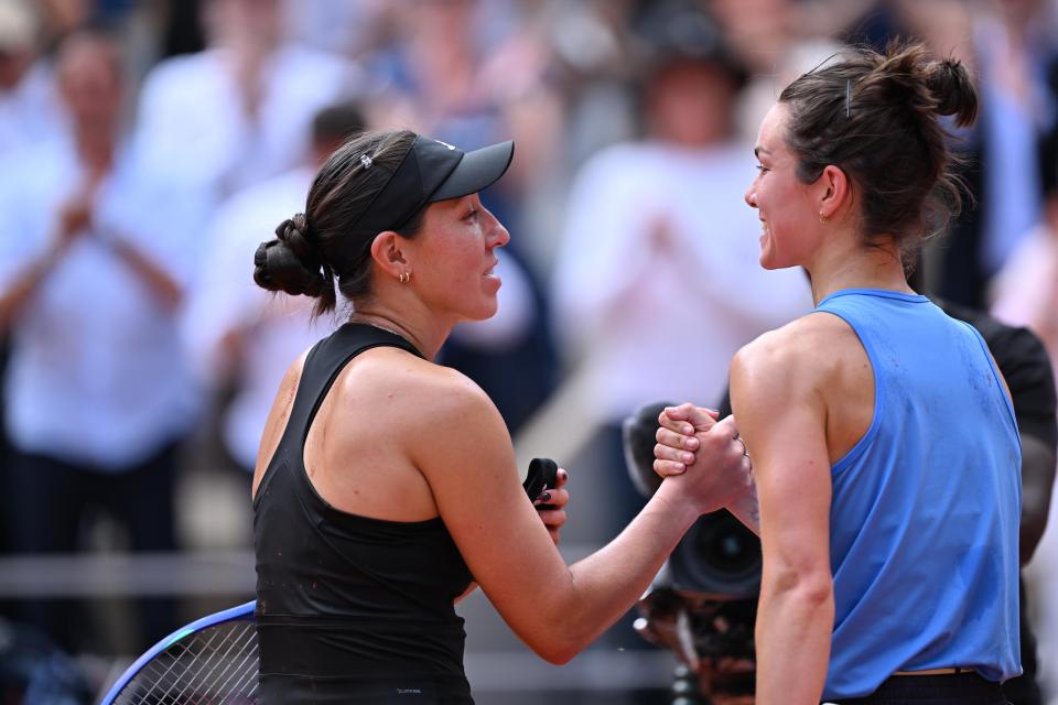 Lois Boisson and Jessica Pegula shaking hands after a tennis match.