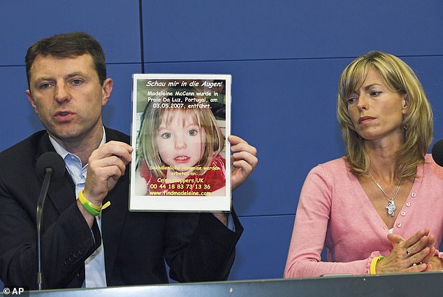 Gerry, left, and Kate McCann, parents of four-year old Madeleine McCann, present a picture of their daughter during a press conference in Berlin, Wednesday, June 6, 2007