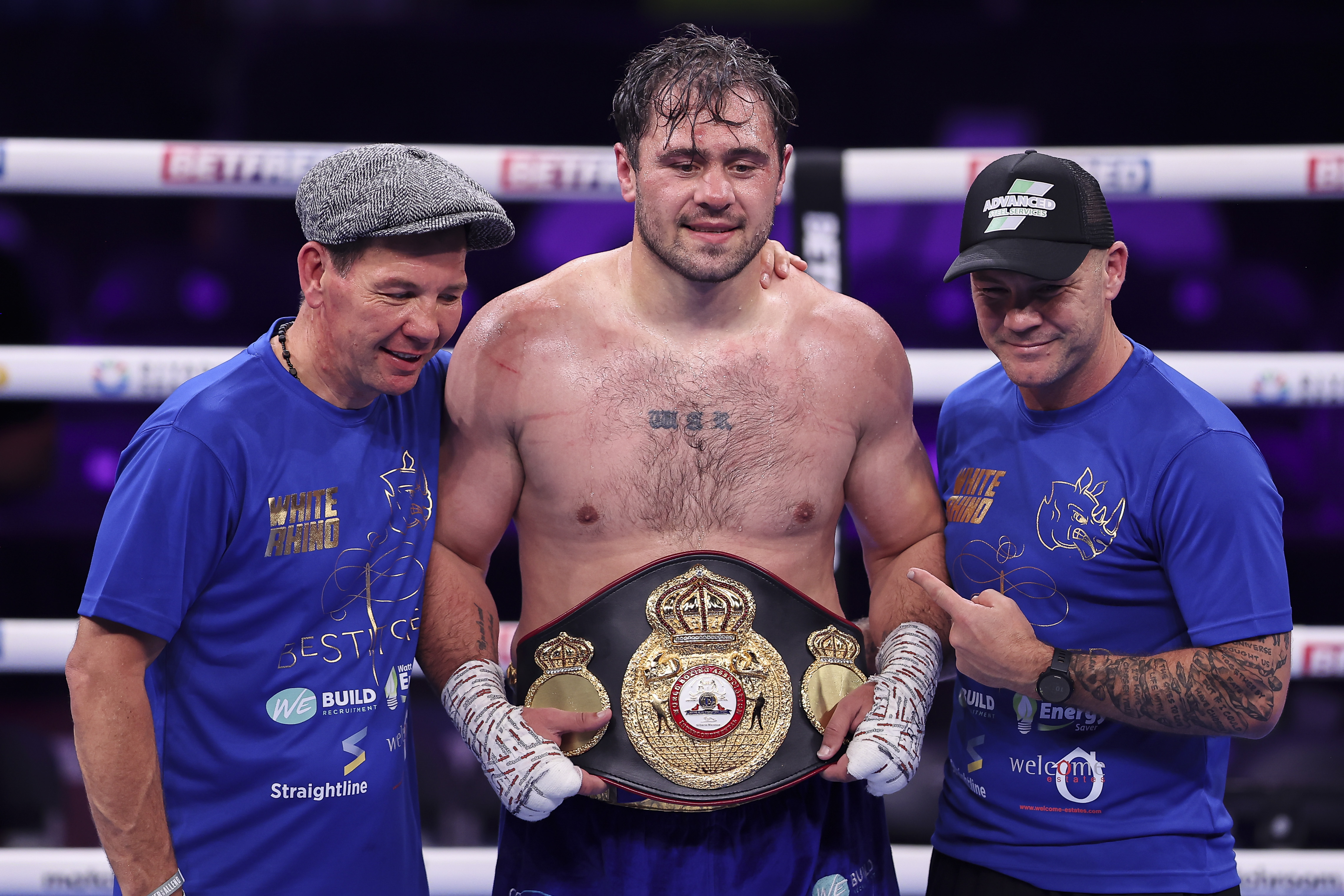 Boxer Dave Allen with his team and championship belt.