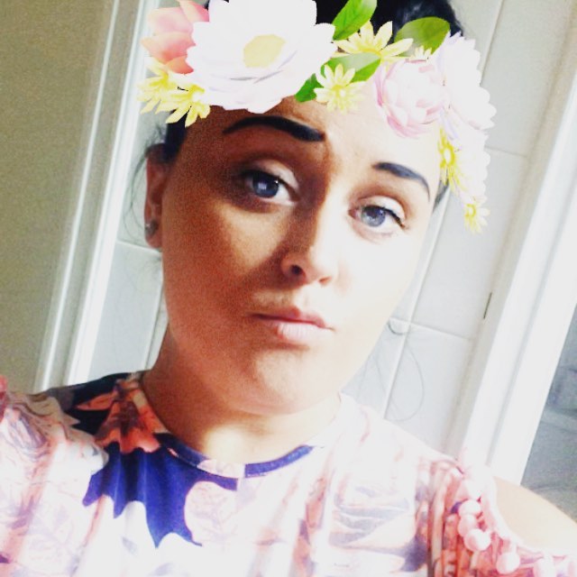 Close-up selfie of Chelsey Knox, former teaching assistant, wearing a flower crown filter.