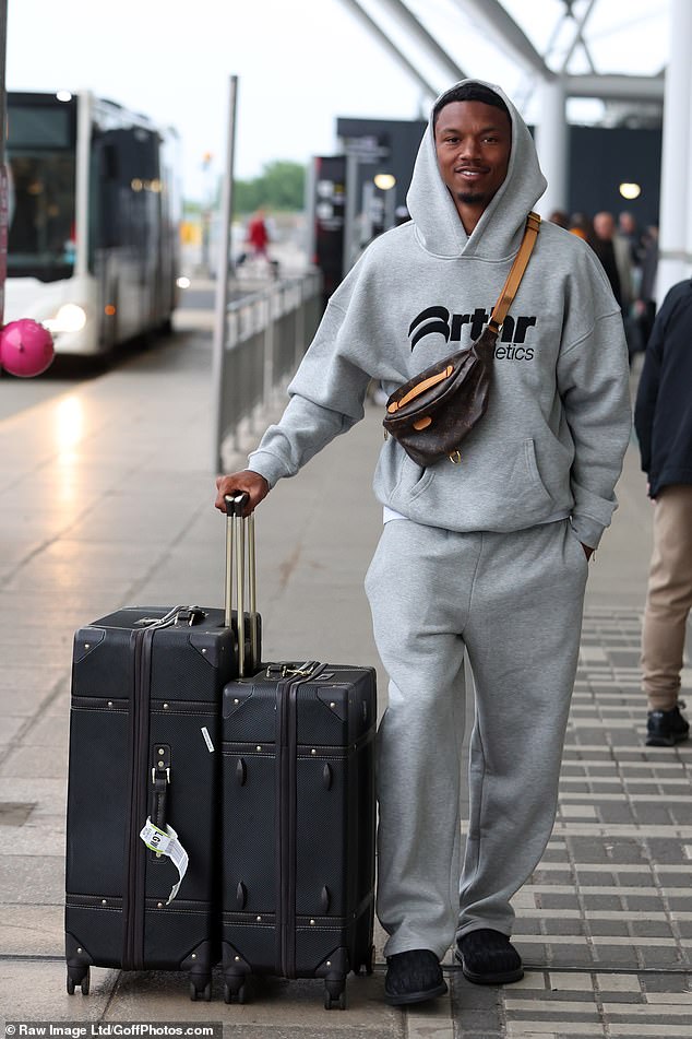 Roman Hackett was dressed down in a grey tracksuit
