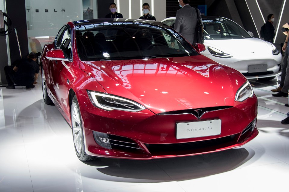 Red Tesla Model S on display.