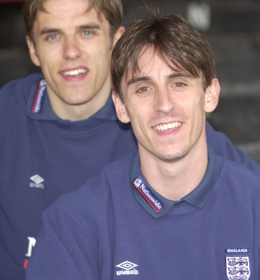 Two men in England soccer jerseys.