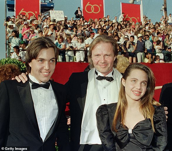 The beauty's first role was as Tosh Warner in 1982's Lookin' To Get Out; she was billed as Angelina Jolie Voight. Her co-stars were dad Jon as well as legend Ann-Margret