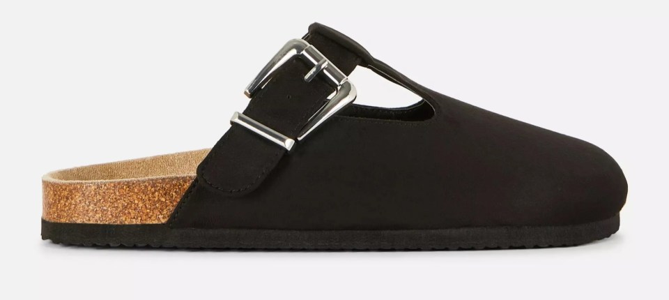 Black buckle mule with cork sole.