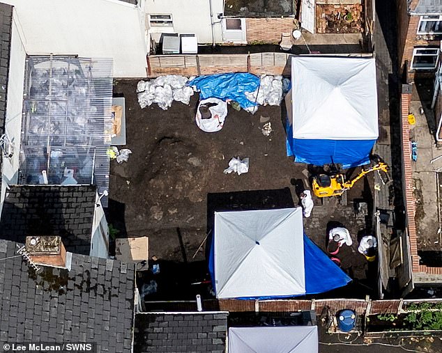 Police are seen scouring the garden of a house on Princes Street in Normanton, where they uncovered human remains believed to belong Izabela