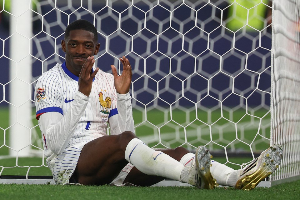 Ousmane Dembele reacts after missing a goal.