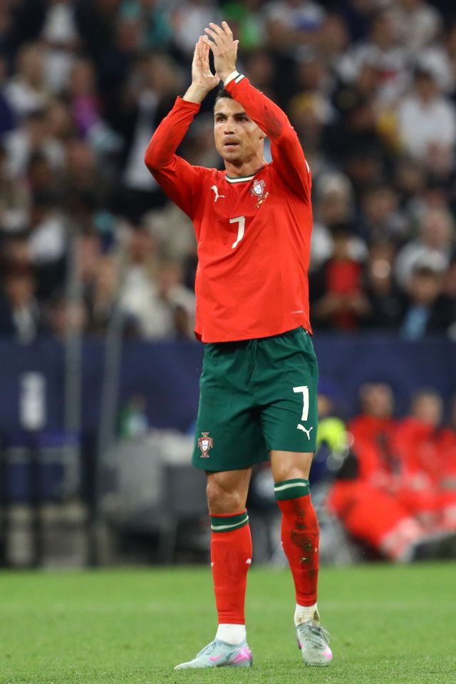 Cristiano Ronaldo applauding after a soccer game.