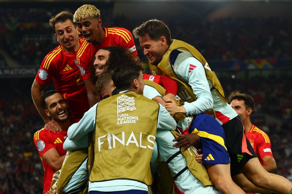 Spanish soccer players celebrating a goal during a UEFA Nations League Finals match.