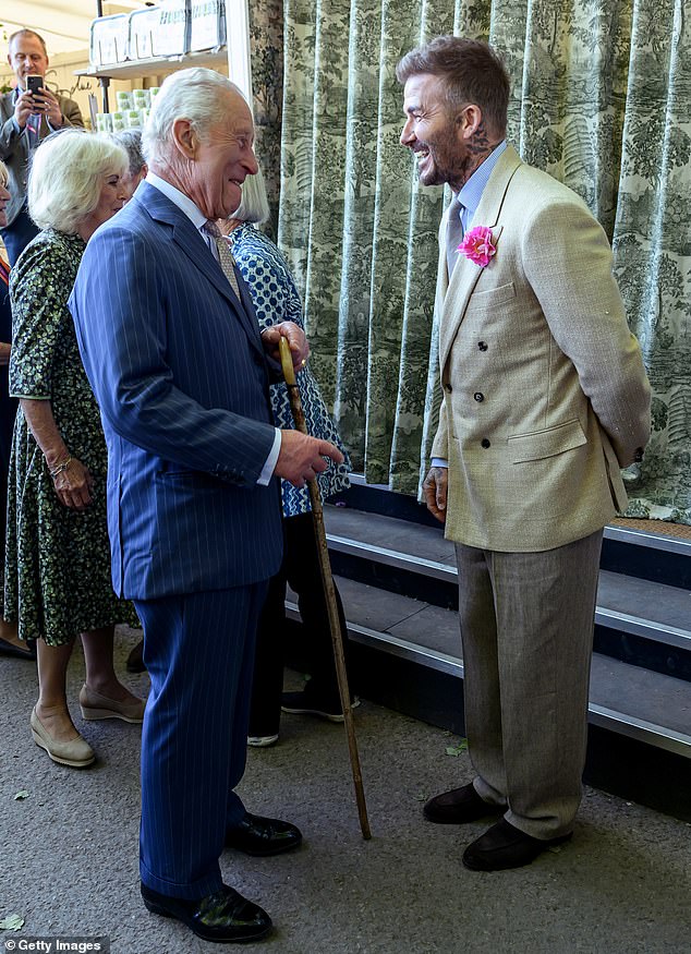 Beckham shares a joke with the 76-year-old monarch at the RHS Chelsea Flower Show -- May, 2025