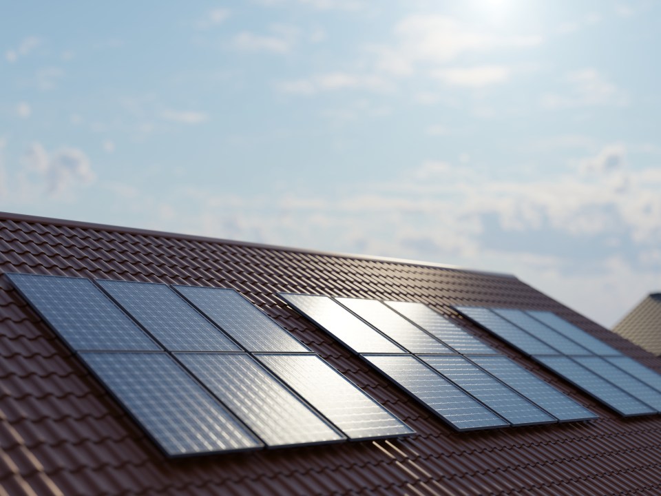 Illustration of solar panels on a house roof.