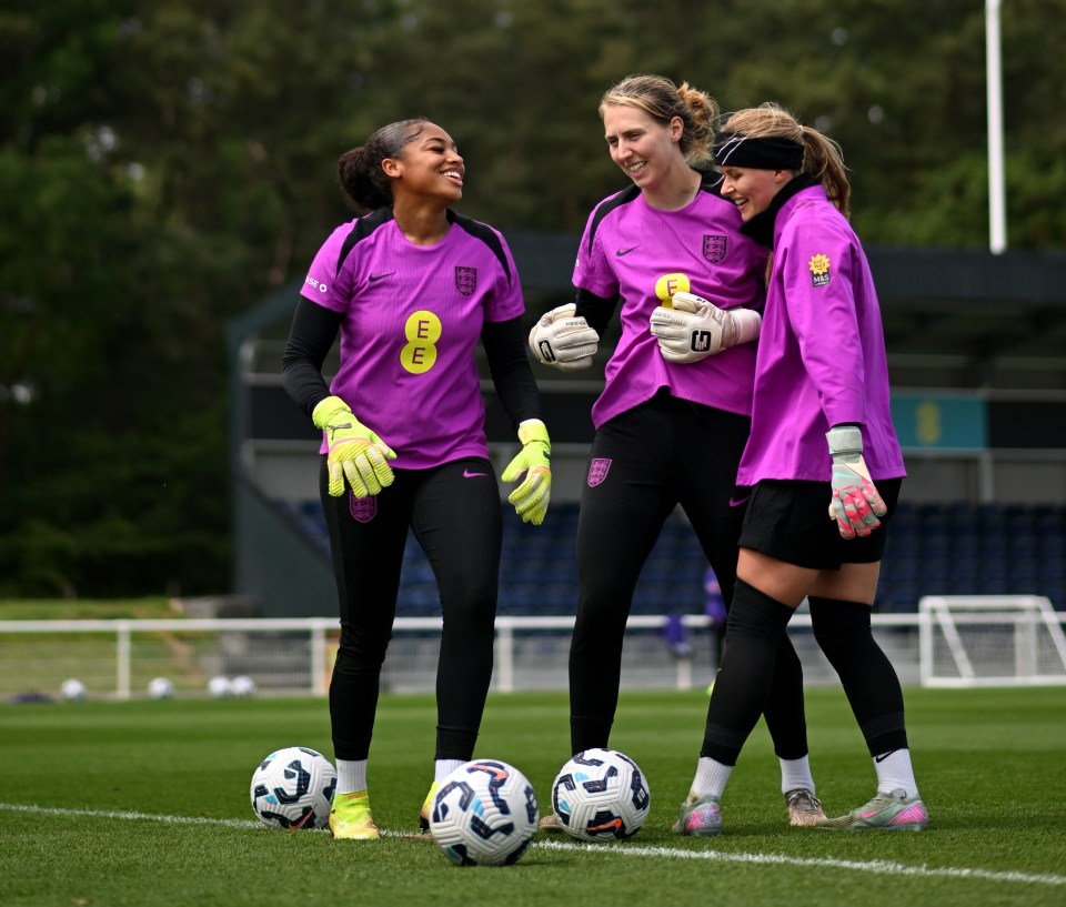 Three England women's soccer goalkeepers during a training session.