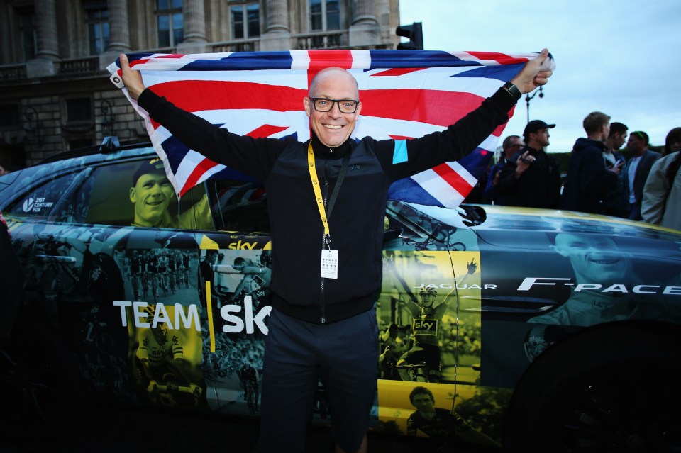 Team Sky manager celebrating Chris Froome's 2015 Tour de France victory.
